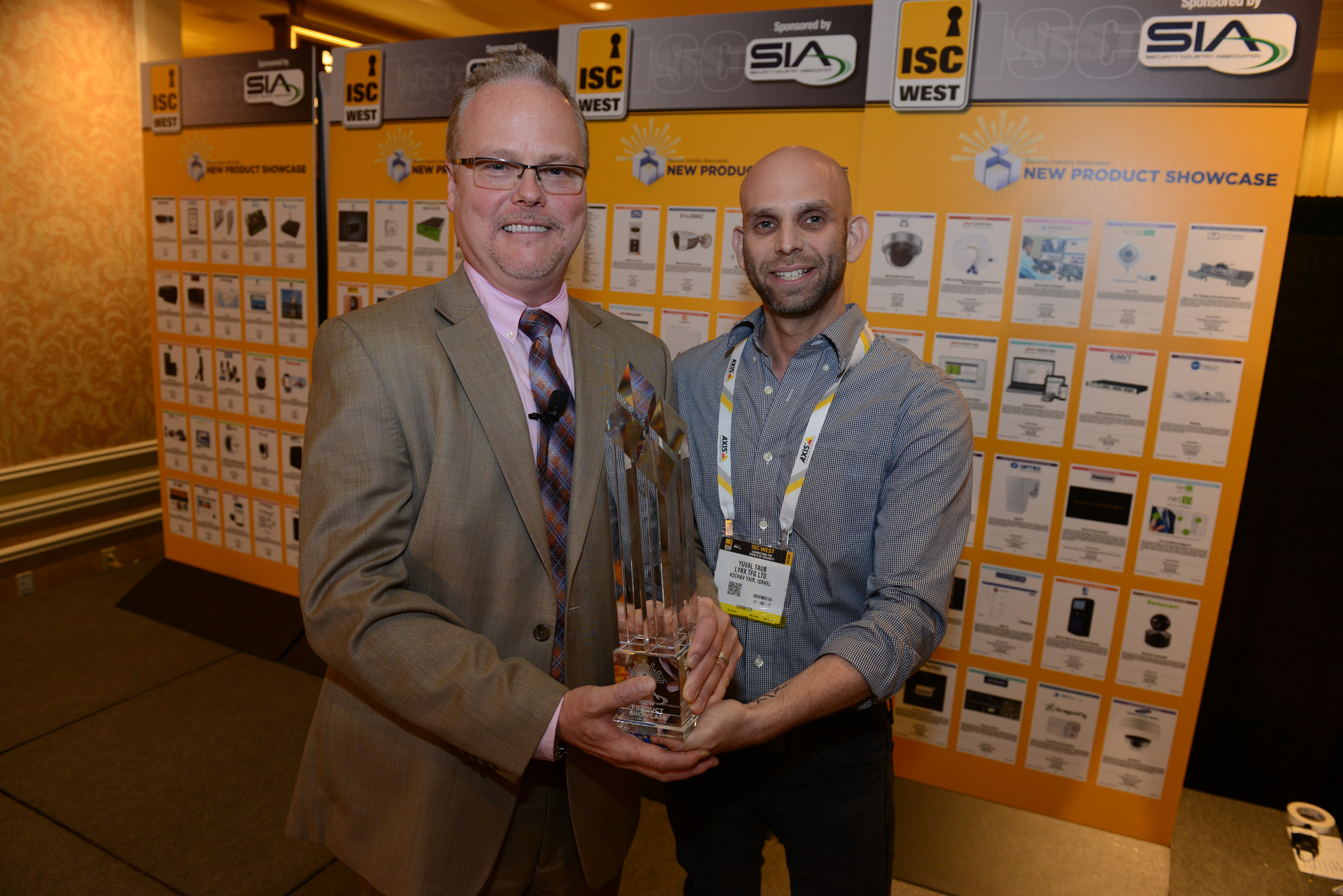 Rand Price, Chief Operating Officer of the Security Industry Association, awards Yuval Taub of LYNX TFG Ltd., Best New Product in the 2016 SIA New Product Showcase.