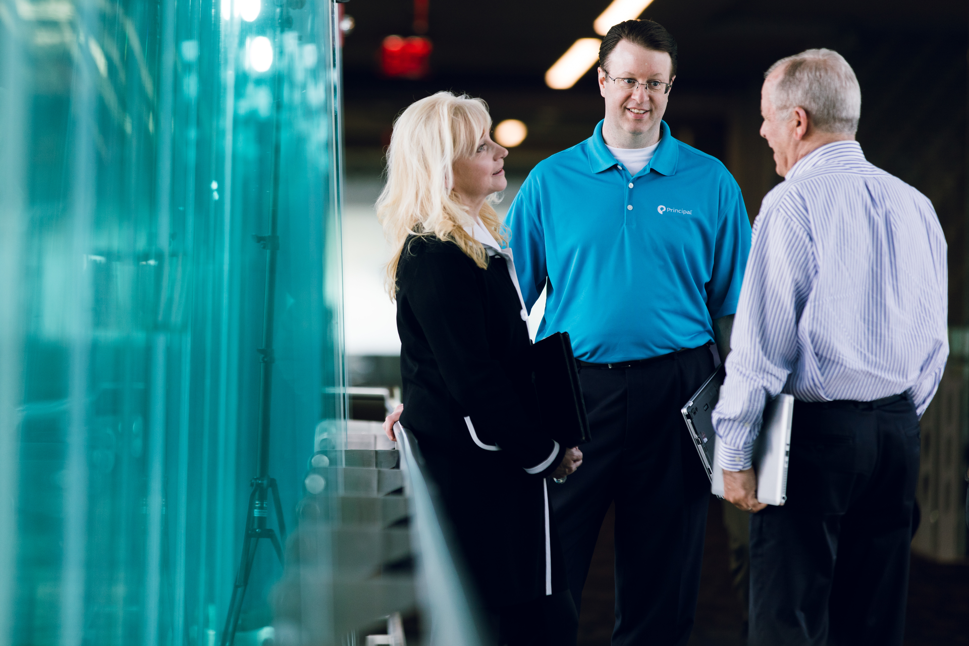 Sandy Cowie, Director of Global Security at Principal (left), shares a moment with senior members of her security staff, Jim Ellis, Assistant Director of Site Security (center) and Pete Lowell, Assistant Director of Personnel Security (right).