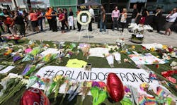 A memorial at Dr. Phillips Center for the Pulse Nightclub victims is growing in size Monday, June 13, 2016 as people come to pay their respects after the horrific mass shooting early Sunday morning in Orlando.