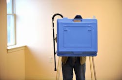 An elderly voter hangs his cane on the booth while voting in the State College Evangelical Free Church, in State College, Pennsylvania. An elderly voter hangs his cane on the booth while voting in the State College Evangelical Free Church, in State College, Pennsylvania.