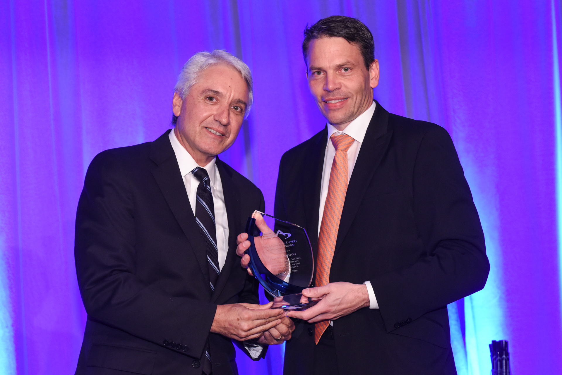 George Fletcher of Mission 500 presents Fredrik Nilsson with the George R. Lippert Award.