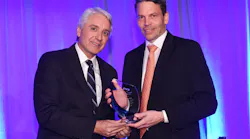 George Fletcher of Mission 500 presents Fredrik Nilsson with the George R. Lippert Award.