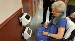 A resident at Brevillier Village uses the IOM Access Control reader.