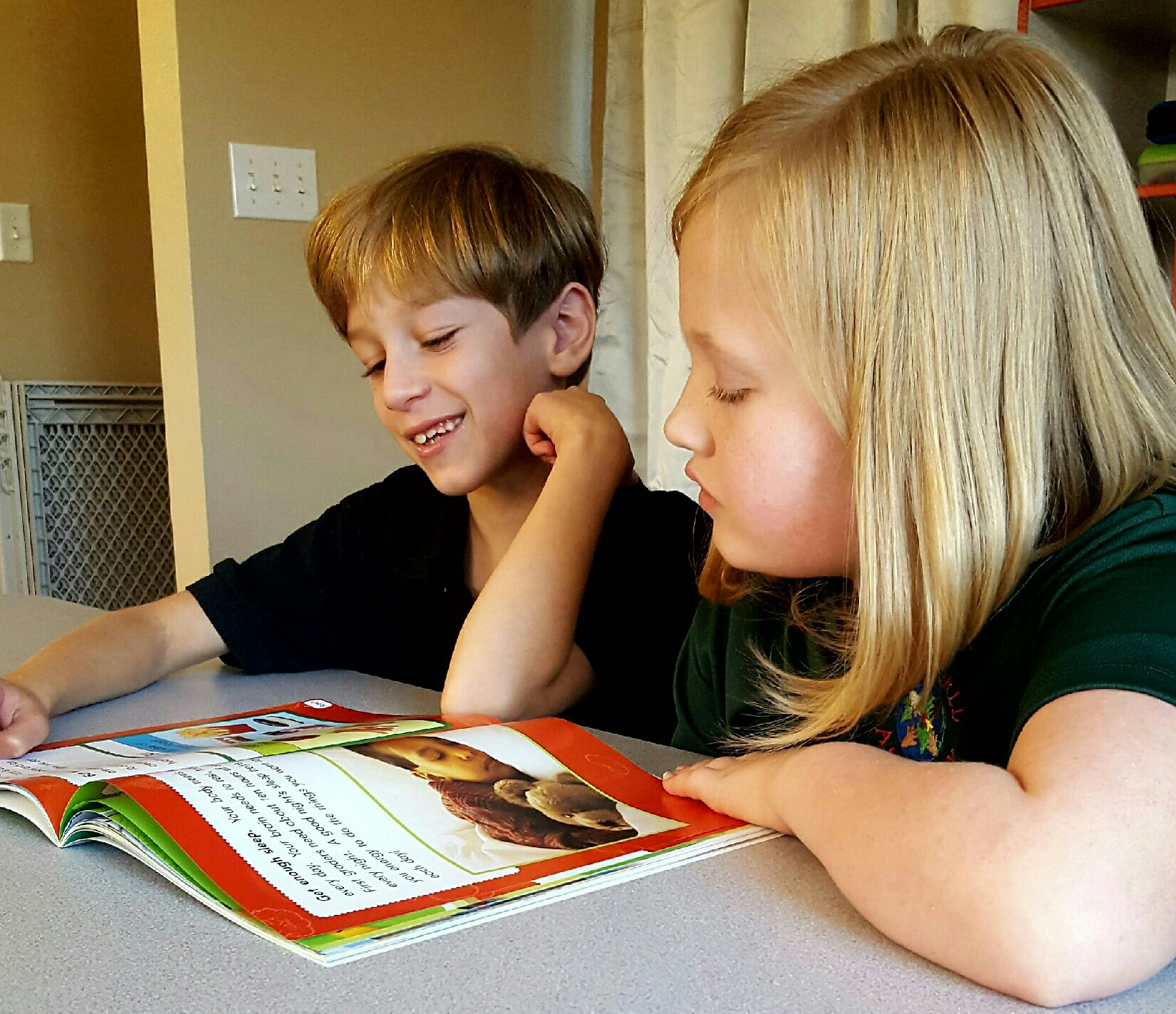 Two Kids World Academy students at work in the classroom. Kids World Academy has a new Hikvision security system, which school director Brandon Francis said will 'really make a difference for our students and their families, providing security and a helping hand in the classroom too.'