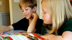 Two Kids World Academy students at work in the classroom. Kids World Academy has a new Hikvision security system, which school director Brandon Francis said will 'really make a difference for our students and their families, providing security and a helping hand in the classroom too.'