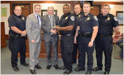 SIAC presents a dispatch reduction award to Lexington, S.C.: (L to R) Patrolman First Class Ryan Whitlock, Mayor Steve MacDougall, Glen Mowrey, Chief Terrence Green, Lt. Matt Timmerman, Major Matt Davis, and Lt. Thomas Stowe. SIAC presents a dispatch reduction award to Lexington, S.C.: (L to R) Patrolman First Class Ryan Whitlock, Mayor Steve MacDougall, Glen Mowrey, Chief Terrence Green, Lt. Matt Timmerman, Major Matt Davis, and Lt. Thomas Stowe.