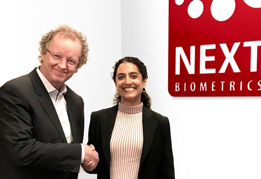 NEXT Biometric&apos;s Chairman of the Board Tore Etholm-Idsoe, left, shanks the hand of new CEO Ritu Favre.
