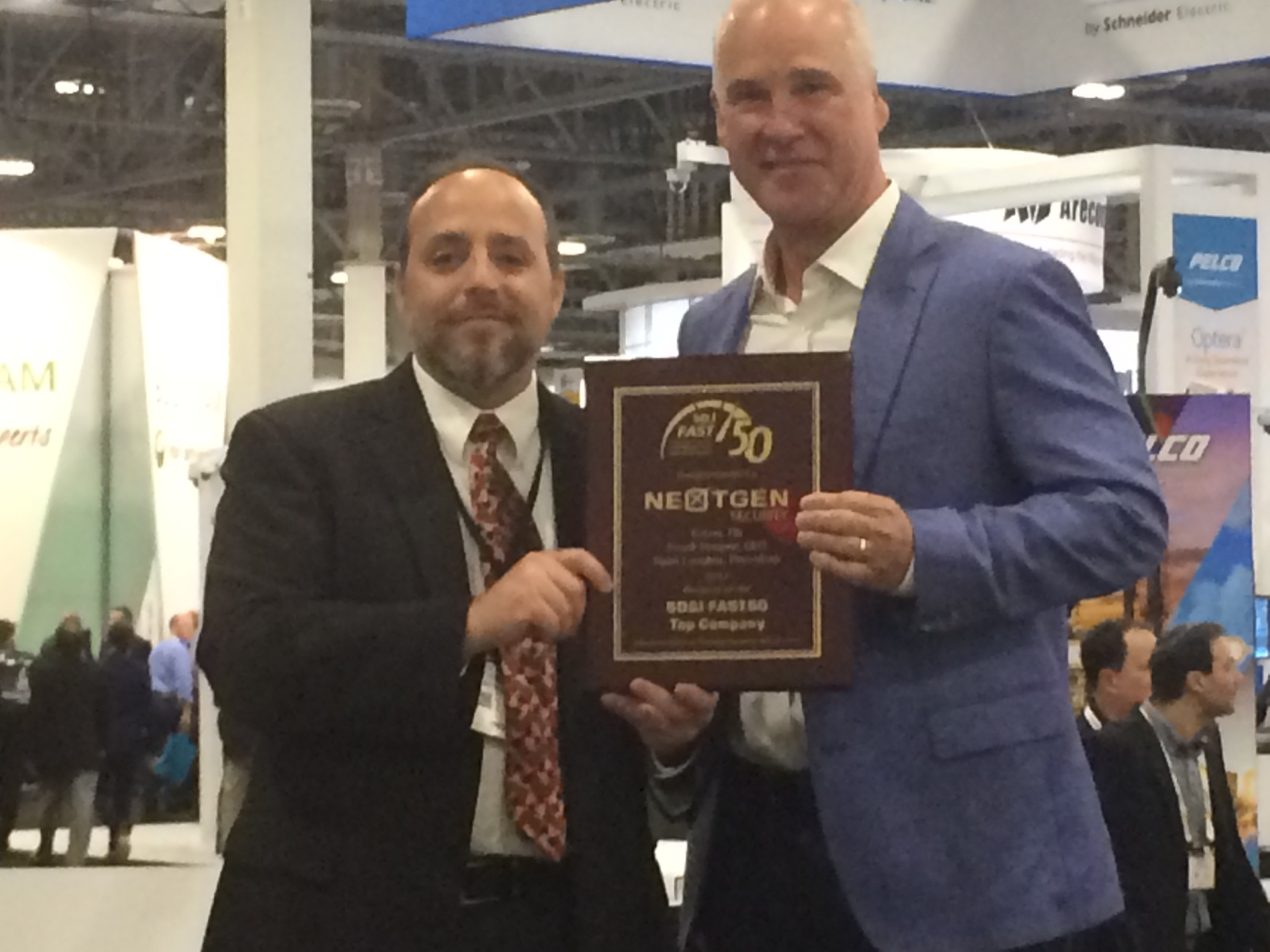 Frank Brewer, CEO of NextGen Security, accepted the top integrator award in the SD&I Fast50 from Editor in Chief Paul Rothman at ISC West on Wednesday.