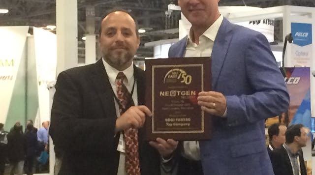 Frank Brewer, CEO of NextGen Security, accepted the top integrator award in the SD&amp;I Fast50 from Editor in Chief Paul Rothman at ISC West on Wednesday.