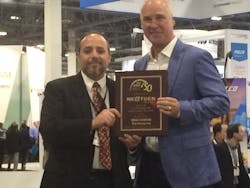 Frank Brewer, CEO of NextGen Security, accepted the top integrator award in the SD&I Fast50 from Editor in Chief Paul Rothman at ISC West on Wednesday. Frank Brewer, CEO of NextGen Security, accepted the top integrator award in the SD&I Fast50 from Editor in Chief Paul Rothman at ISC West on Wednesday.