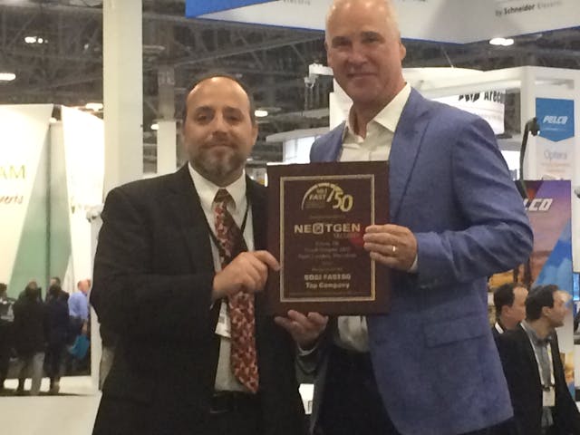 Frank Brewer, CEO of NextGen Security, accepted the top integrator award in the SD&amp;I Fast50 from Editor in Chief Paul Rothman at ISC West on Wednesday.