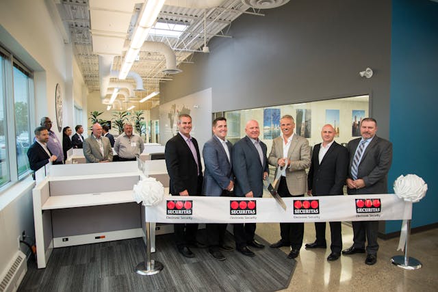 At the ribbon cutting of Securitas ES&apos; Canadian Headquarters: Jeff Hennessy, Area Installation Manager, SES Canada; Kevin Engelhardt, Executive Vice President Operations &amp; Enterprise, SES; Dan Marston, Senior Director &amp; General Manager, SES Canada; Tony Byerly, President, SES; Chris Jaynes, district Service Manager, SES Canada; and Mark Drysdale, Area Installation Manager, SES Canada.