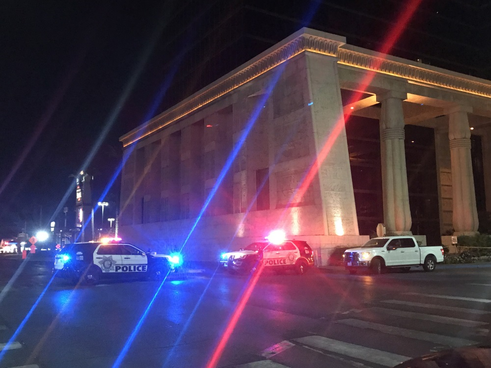 Police vehicles are seen near the site of shooting in Las Vegas, the United States, on Oct. 2, 2017. At least 50 people were killed and over 200 others wounded in a mass shooting at a concert Sunday night outside of the Mandalay Bay Hotel in Las Vegas, Nevada.