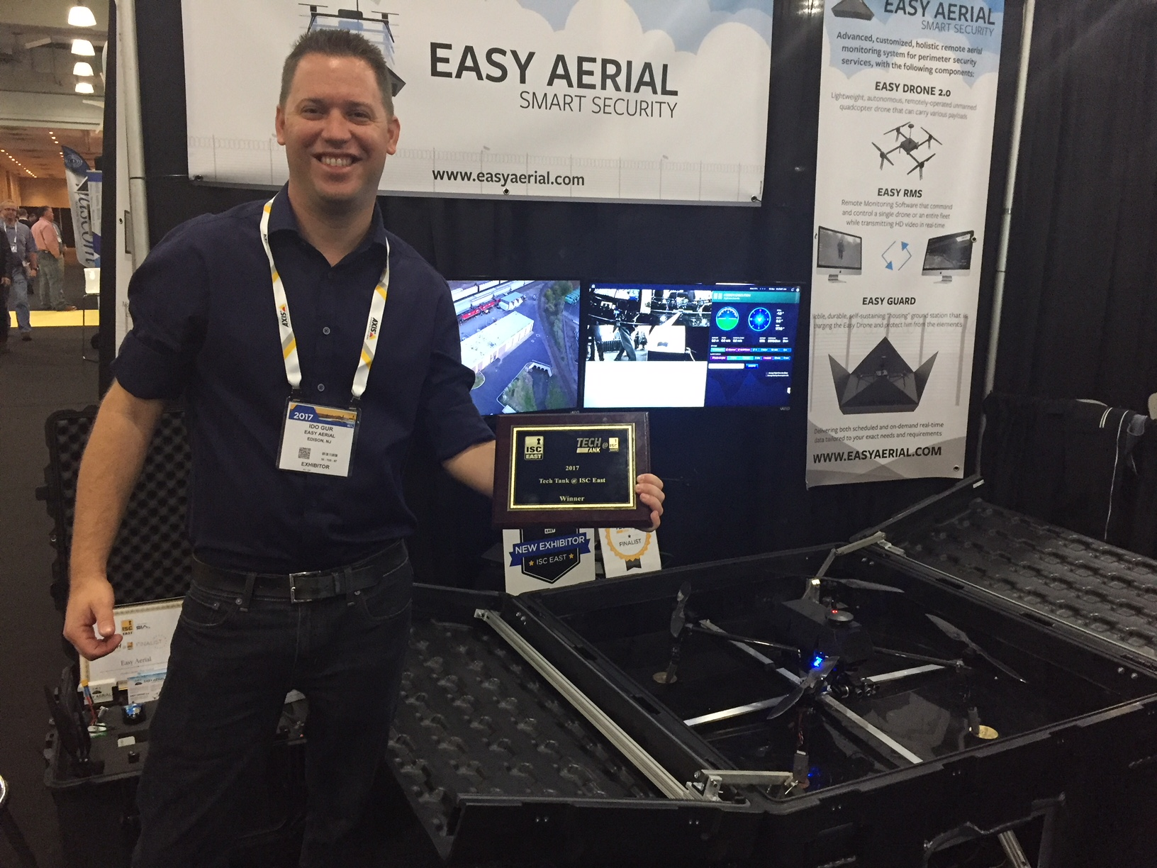 Ido Gur, CEO of Easy Aerial, shows off his company&rsquo;s Tech Tank Award at ISC East in New York.