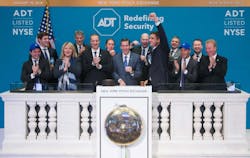 ADT, Inc. Chief Executive Officer Timothy J. Whall, joined by members of ADT&apos;s senior executive team and board of directors, rings the NYSE Opening Bell.