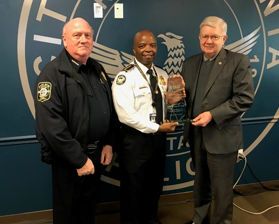 Marietta (GA) Police Chief Dan Flynn and SIAC Law Enforcement National Liaison Glen Mowrey Present Security Industry Alarm Coalition Directors Award of Distinction for Excellence in Alarm Management to Atlanta (GA) Police Deputy Chief Rodney Bryant.