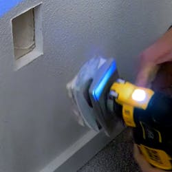 QBit in use with a multi tool cutting in drywall 5a96e6263c150