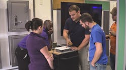 Dealers and integrators get hands-on experience with ASSA ABLOY products inside its Mobile Installation Training Showroom.