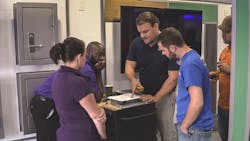 Dealers and integrators get hands-on experience with ASSA ABLOY products inside its Mobile Installation Training Showroom. Dealers and integrators get hands-on experience with ASSA ABLOY products inside its Mobile Installation Training Showroom.
