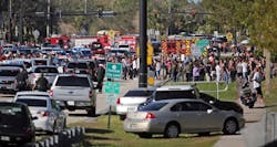 Students are brought across Coral Springs Drive from the campus of Marjory Stoneman Douglas High School in Parkland, Fla., after a shooting on Wednesday, Feb. 14, 2018. Students are brought across Coral Springs Drive from the campus of Marjory Stoneman Douglas High School in Parkland, Fla., after a shooting on Wednesday, Feb. 14, 2018.