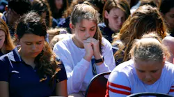 People gather for a memorial at Parkridge Church in Coral Springs, Fla. on Thursday, Feb. 15, 2018, one day after the deadly shooting at Marjory Stoneman Douglas High School in Parkland, Fla.