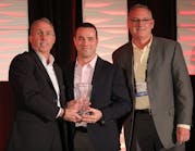 JR Andrews and Bryan McGee of Altronix (right) accept the Superstar Award from PSA&rsquo;s Craig Patterson.
