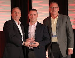 JR Andrews and Bryan McGee of Altronix (right) accept the Superstar Award from PSA&rsquo;s Craig Patterson.