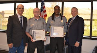 Officers Manuel Byrge (center left) and Gordon Collier (center right) were named Securitas Officer of the Year for Performance and Heroism, respectively. President and CEO, Securitas North America Santiago Galaz (far left) and Chief Operating Officer Bill Barthelemy.