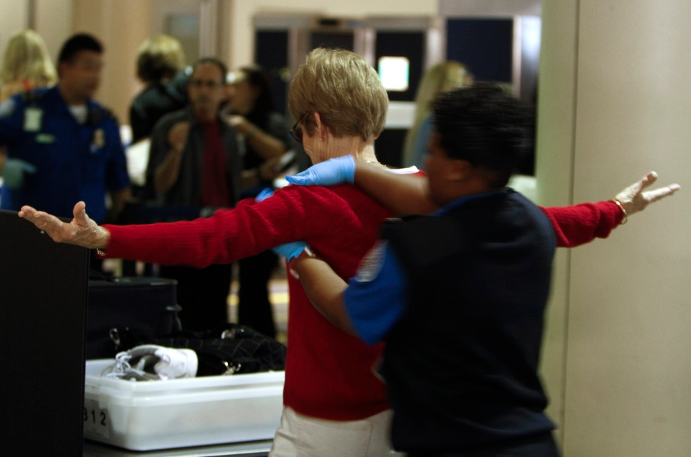 A Transportation Security Administration officer performs a pat-down search on a passenger at Los Angeles International Airport on March 31, 2011.