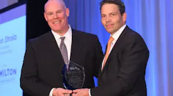 John Stroia accepts the 2017 George R. Lippert Memorial Award from 2016 recipient Fredrik Nilsson.
