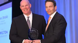 John Stroia accepts the 2017 George R. Lippert Memorial Award from 2016 recipient Fredrik Nilsson. John Stroia accepts the 2017 George R. Lippert Memorial Award from 2016 recipient Fredrik Nilsson.