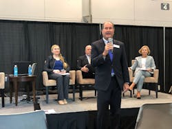 SIA Charman Scott Schafer addresses attendees at GSX while Angela Osborne of Guidepost Solutions, Scott Dunn of Axis Communications and Kathy Lavinder of Security &amp; Investigative Placement look on.