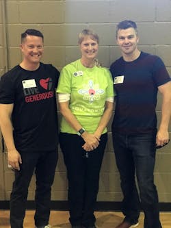 Brian Thomas and Hunter Thornton of A3 Communications donated a much-needed refrigerated truck to Suellen Daniels and the Meal By Grace organization.