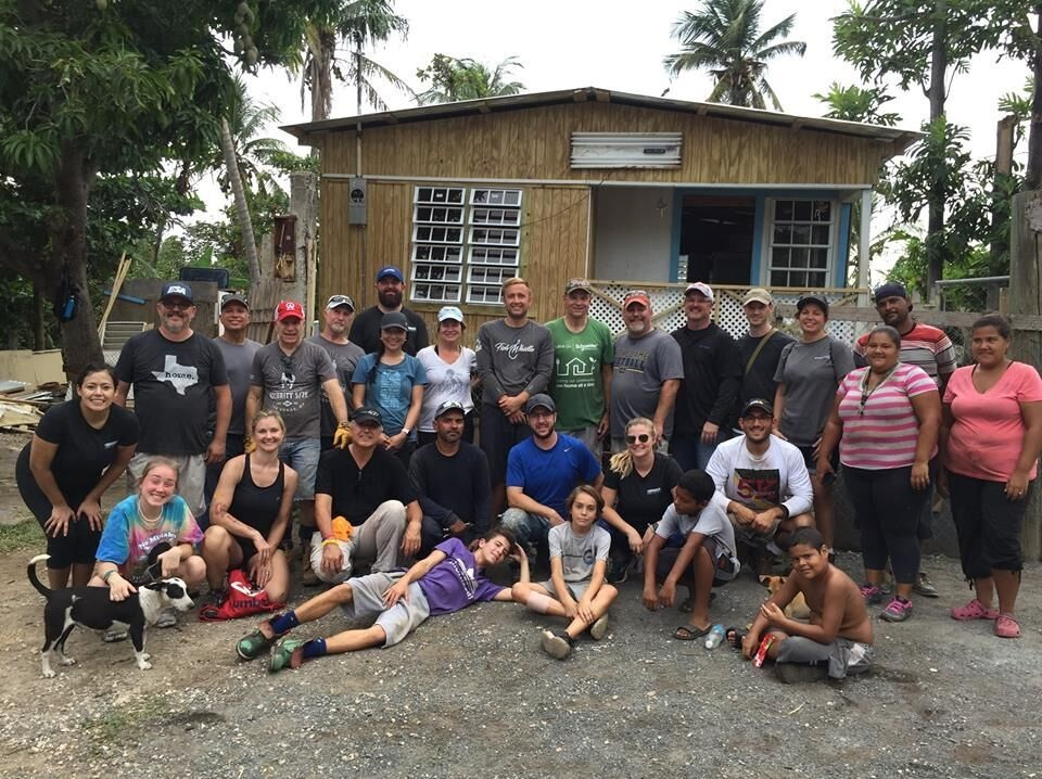 First row (l to r) - Phillippe Forman; Kyle Fletcher; Boys who live in the home. Second row (l to r) - Gwynn Turner; Stephanie Lutz, Wesco; George Fletcher, Mission 500; Guillermo, Site Foreman; Daniel Plaza, Aiphone; Jackie Pruter, Brinks; Matt Rios, Axis; Women who live in home. Third row (l to r) - Sarahi Sanpedro, Brinks; Jason Lutz, Residio, Alan Forman; Altronix, Mariane Chew, Hikvision; Martha Entwistle, Hikvision; Shane Nikov, Hikvision; Rick Bunnell, Retired, Schneider Electric; Nick Pintaro, Axis; Patrick Cooke, Milestone; Brian Hayes, Milestone; Stephanie Mayes, Synetics Global; Dad of the house. Fourth row (l to r) &ndash; Roland Cruz, FE Puerto Rico; Tom Nolan, Mission 500; Eric Hattey, Brinks