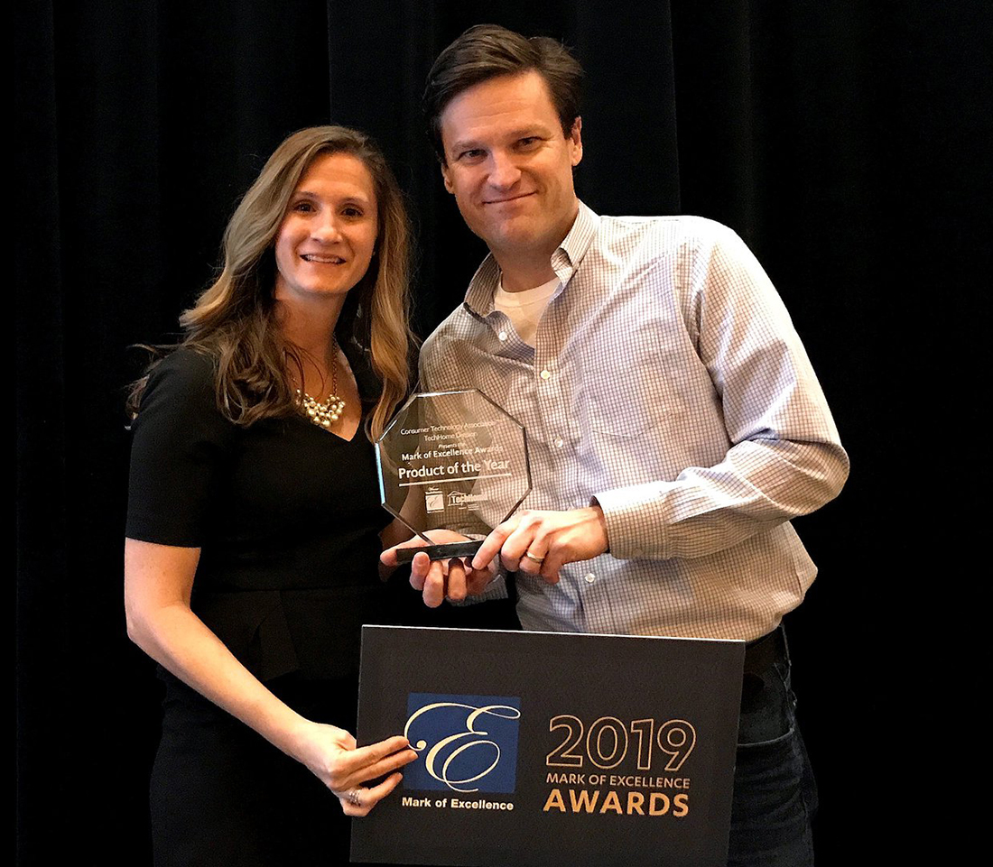 Alarm'com's Matt Zartman accepts the 2019 Mark of Excellence Award at CES 2019.