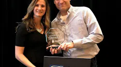 Alarm'com's Matt Zartman accepts the 2019 Mark of Excellence Award at CES 2019.