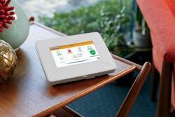 The Interlogix Simon touchscreen panel controls home security and automation features. The Interlogix Simon touchscreen panel controls home security and automation features.