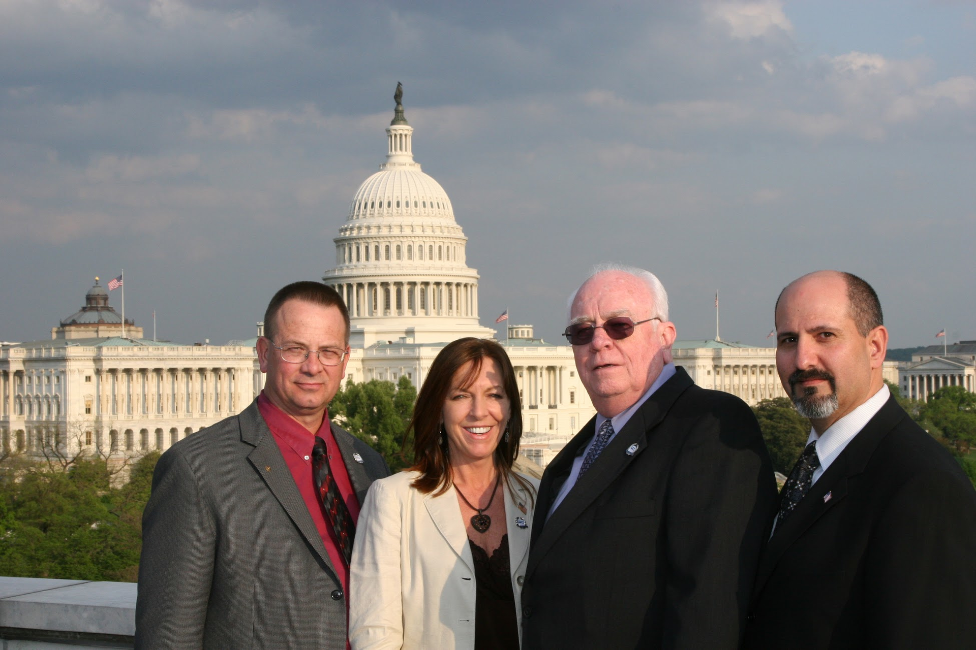 George Gunning (center), along with former ESA president Mike Miller, the late Tonja Jenkins, and current ESA Executive Director and CEO Merlin Guilbeau, took an active role in advocating for security industry-related legislation.