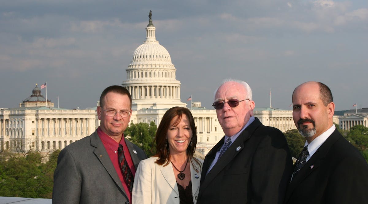 George Gunning (center), along with former ESA president Mike Miller, the late Tonja Jenkins, and current ESA Executive Director and CEO Merlin Guilbeau, took an active role in advocating for security industry-related legislation.