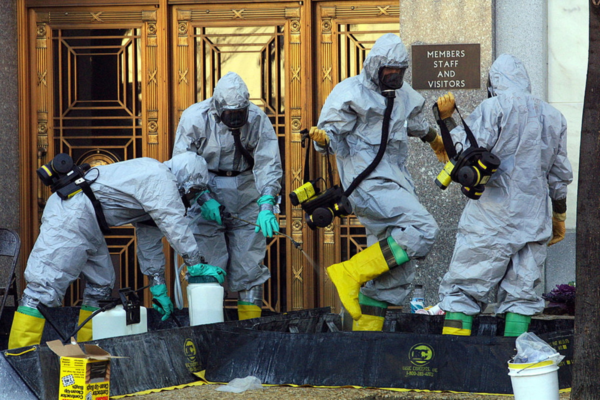 A hazardous material worker sprays his colleagues after they came out from an anthrax search at Dirksen Senate Office Building November 18, 2001 on Capitol Hill in Washington, D.C. The Department of Homeland Security stored sensitive data from the nation's bioterrorism defense program on an insecure website where it was vulnerable to attacks by hackers for over a decade, according to government documents.