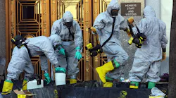 A hazardous material worker sprays his colleagues after they came out from an anthrax search at Dirksen Senate Office Building November 18, 2001 on Capitol Hill in Washington, D.C. The Department of Homeland Security stored sensitive data from the nation's bioterrorism defense program on an insecure website where it was vulnerable to attacks by hackers for over a decade, according to government documents.