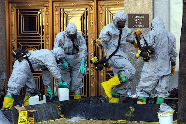 A hazardous material worker sprays his colleagues after they came out from an anthrax search at Dirksen Senate Office Building November 18, 2001 on Capitol Hill in Washington, D.C. The Department of Homeland Security stored sensitive data from the nation&apos;s bioterrorism defense program on an insecure website where it was vulnerable to attacks by hackers for over a decade, according to government documents.
