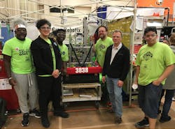 Paul Wisotzke, manager, test and validation, LenelS2 (black jacket, second from right), is one of several company mentors supporting Pathways in Technology (P-TECH) in Rochester, N.Y. The international six-year program helps prepare students for IT-based careers in security and other industries. A LenelS2 grant enabled a high school team to build a robot in a recent regional P-TECH competition. Paul Wisotzke, manager, test and validation, LenelS2 (black jacket, second from right), is one of several company mentors supporting Pathways in Technology (P-TECH) in Rochester, N.Y. The international six-year program helps prepare students for IT-based careers in security and other industries. A LenelS2 grant enabled a high school team to build a robot in a recent regional P-TECH competition.