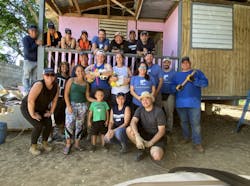 Thirty Mission 500 volunteers lent their physical support along with financial assistance to help assist two families this year. One house was essentially rebuilt from the foundation up by reinforcing unstable flooring, installing new siding and a new roof. The second house received a small addition and a new bathroom that replaced an old outhouse. One house received a new washing machine, and the other received a new refrigerator. The team also provided new doors for bedrooms, bedsheets and carpet to provide improved living conditions for the families. Volunteer support came from representatives of 11 companies, including ADS Security, Altronix, Axis, Brinks, Core Logics, Five Alarm Security, Galaxy Systems, Gould Alarm Communications, Hikvision, Milestone, Resideo Pro Security, and WeSuite. Thirty Mission 500 volunteers lent their physical support along with financial assistance to help assist two families this year. One house was essentially rebuilt from the foundation up by reinforcing unstable flooring, installing new siding and a new roof. The second house received a small addition and a new bathroom that replaced an old outhouse. One house received a new washing machine, and the other received a new refrigerator. The team also provided new doors for bedrooms, bedsheets and carpet to provide improved living conditions for the families. Volunteer support came from representatives of 11 companies, including ADS Security, Altronix, Axis, Brinks, Core Logics, Five Alarm Security, Galaxy Systems, Gould Alarm Communications, Hikvision, Milestone, Resideo Pro Security, and WeSuite.