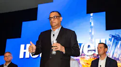 Vikas Chadha, Vice President for Commercial Security at Honeywell, addresses attendees during a panel discussion at the company's recent Building for the Future event in Miami.