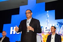 Vikas Chadha, Vice President for Commercial Security at Honeywell, addresses attendees during a panel discussion at the company&apos;s recent Building for the Future event in Miami.