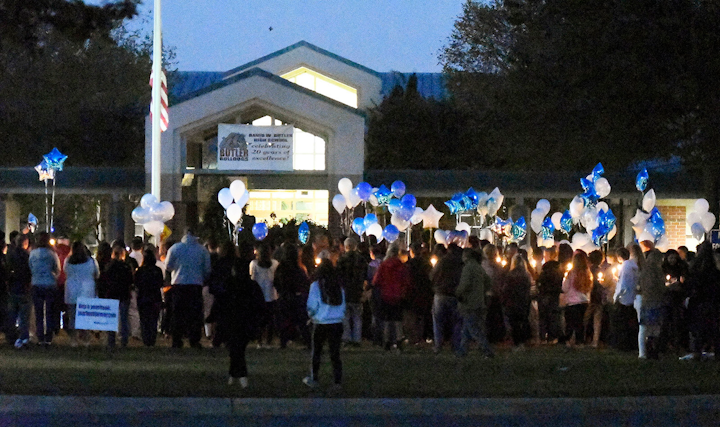 Students hold candles during a vigil at Butler High School in the wake of the shooting death of 16-year-old sophomore Bobby McKeithen by 16-year-old freshman Jatwan Craig Cuffie at the school on Oct. 29, 2018. Cuffie pleaded guilty to voluntary manslaughter.
