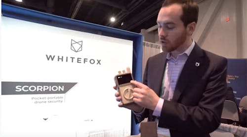 WhiteFox Defense CEO Luke Fox demos a portable hand-held drone detection device at CES.