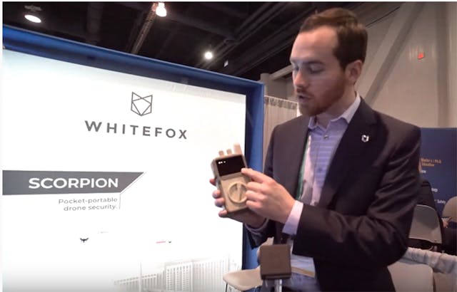 WhiteFox Defense CEO Luke Fox demos a portable hand-held drone detection device at CES.
