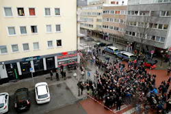 German Justice Minister Christine Lambrecht, German Interior Minister Horst Seehofer, Hesse's State Premier Volker Bouffier and Hesse state Interior Minister Peter Beuth speak to medias after laying flowers watched by people from their appartments above the 'Midnight' Bar, one of the bar targeted in a shooting at the Heumarkt in the centre of Hanau, near Frankfurt am Main, western Germany, on February 20, 2020, after at least nine people were killed in two shootings late on February 19, 2020. - The suspect in two shootings in Germany that killed at least nine people was found dead at home, police said on February 20, 2020. At least nine people were killed in two shootings late on February 19 in Hanau, near the German city of Frankfurt. German Justice Minister Christine Lambrecht, German Interior Minister Horst Seehofer, Hesse's State Premier Volker Bouffier and Hesse state Interior Minister Peter Beuth speak to medias after laying flowers watched by people from their appartments above the 'Midnight' Bar, one of the bar targeted in a shooting at the Heumarkt in the centre of Hanau, near Frankfurt am Main, western Germany, on February 20, 2020, after at least nine people were killed in two shootings late on February 19, 2020. - The suspect in two shootings in Germany that killed at least nine people was found dead at home, police said on February 20, 2020. At least nine people were killed in two shootings late on February 19 in Hanau, near the German city of Frankfurt.